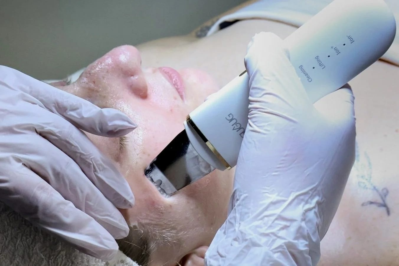 Client receiving a gentle eye-area facial treatment Client receiving a gentle eye-area facial treatment