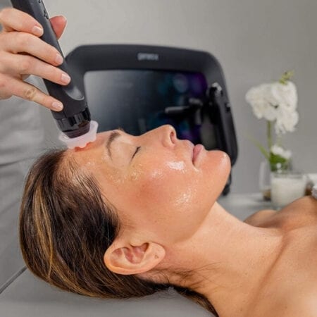 Client receiving a deep-cleansing facial treatment Client receiving a deep-cleansing facial treatment