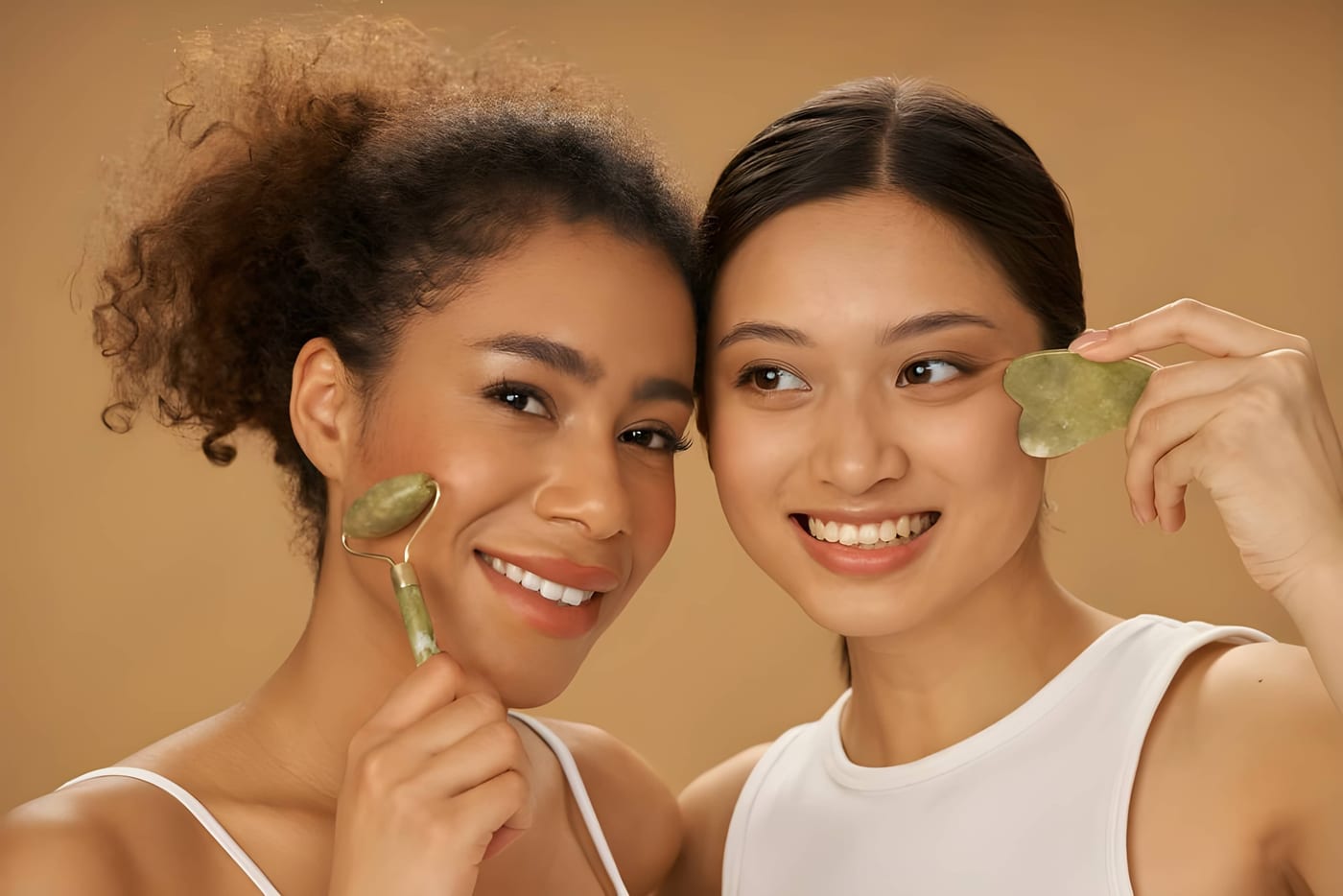 Clients using gua sha and facial roller tools Clients using gua sha and facial roller tools