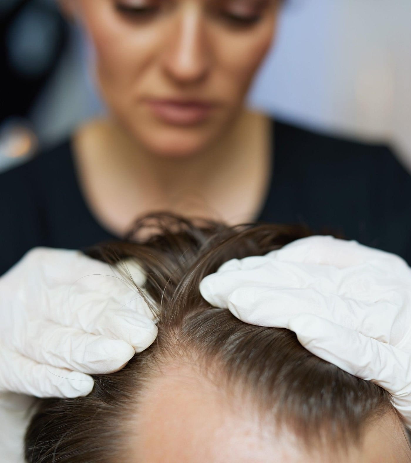 Keratin treatment being applied to a male client's hair